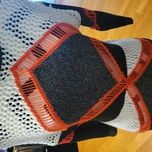 Black and White Knit Sweater with Orange Accents
